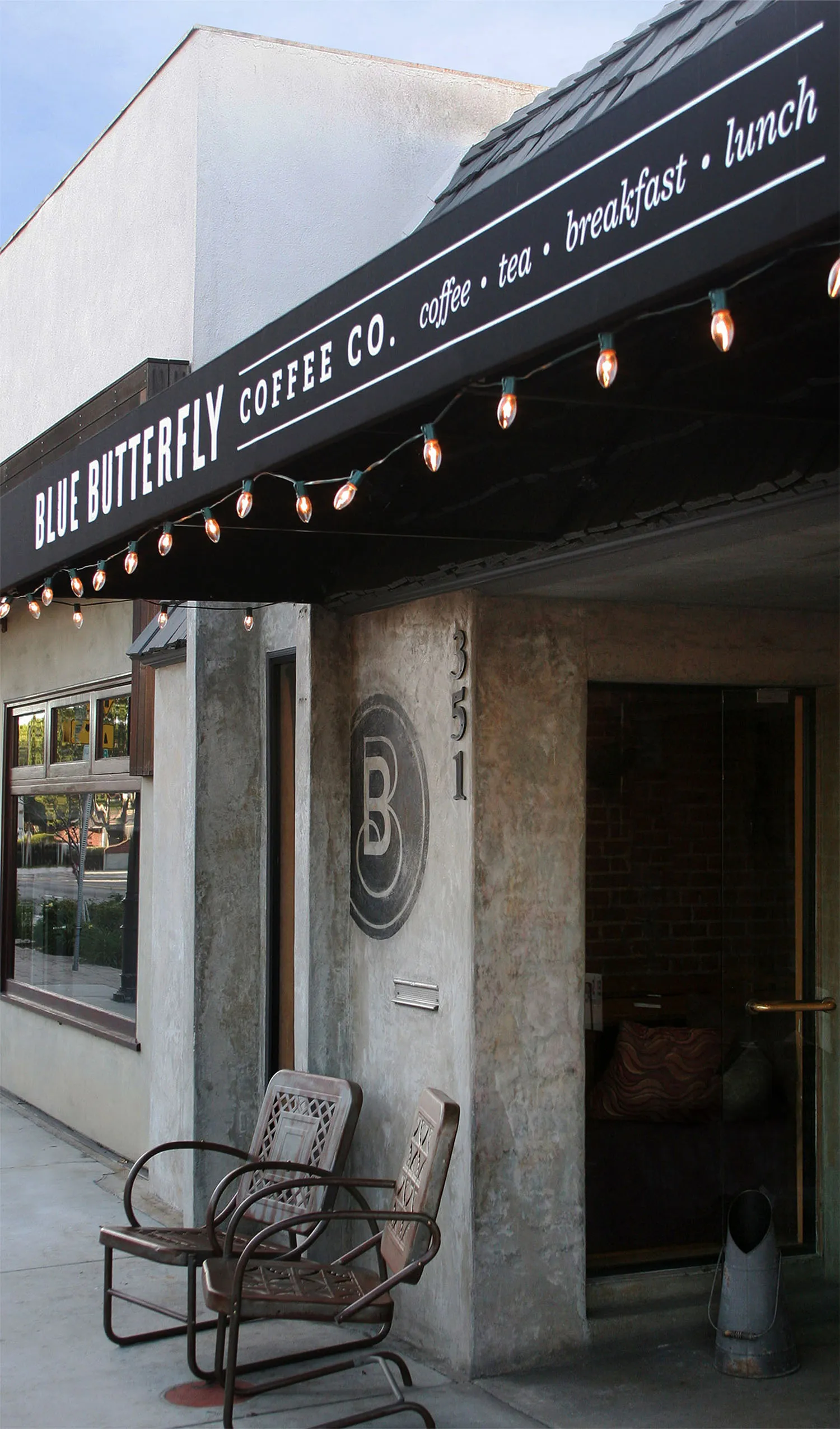 Blue Butterfly Coffee Co. storefront with awning signage.