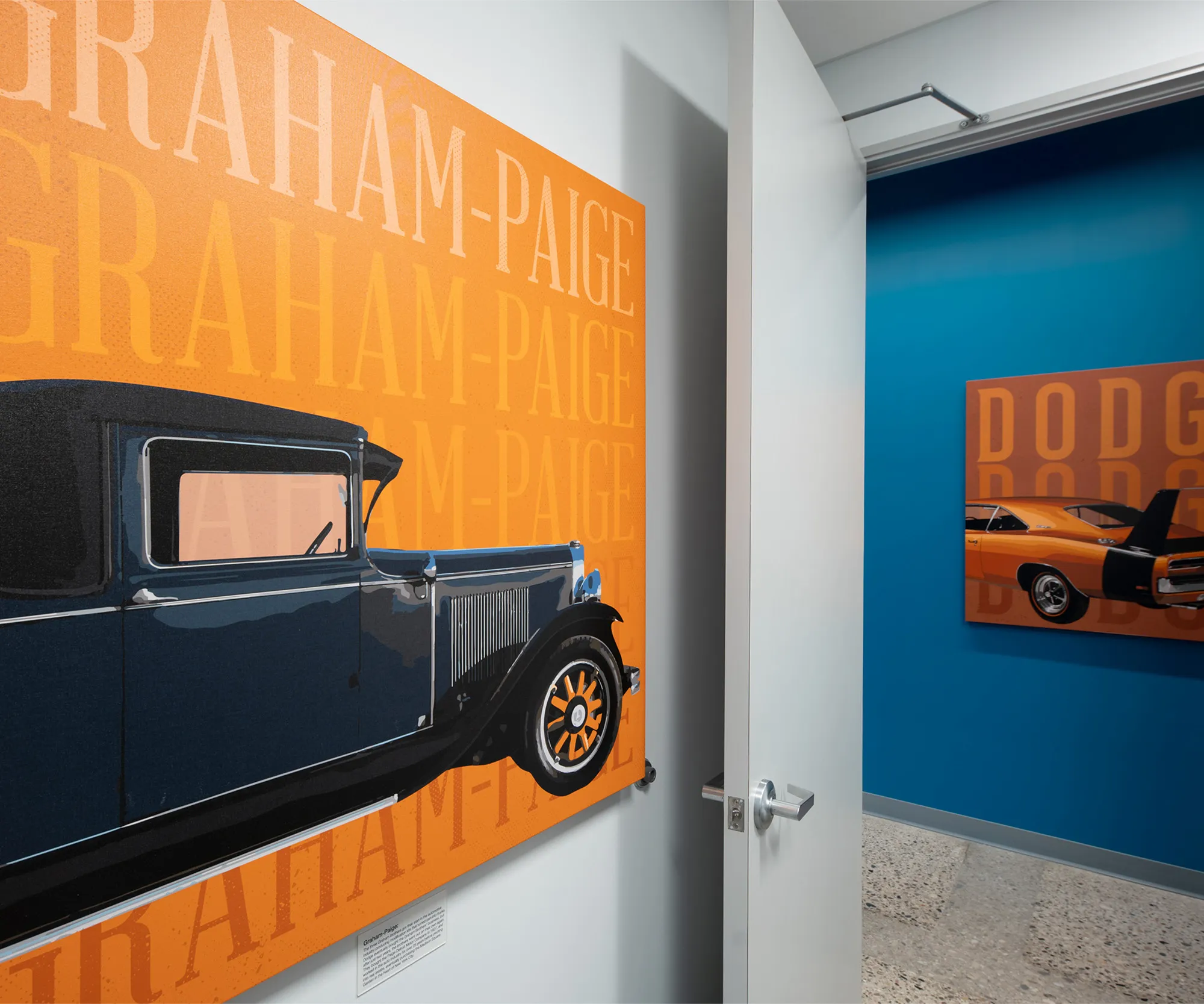 Clinic corridor with a vintage car mural and Graham-Paige lettering.