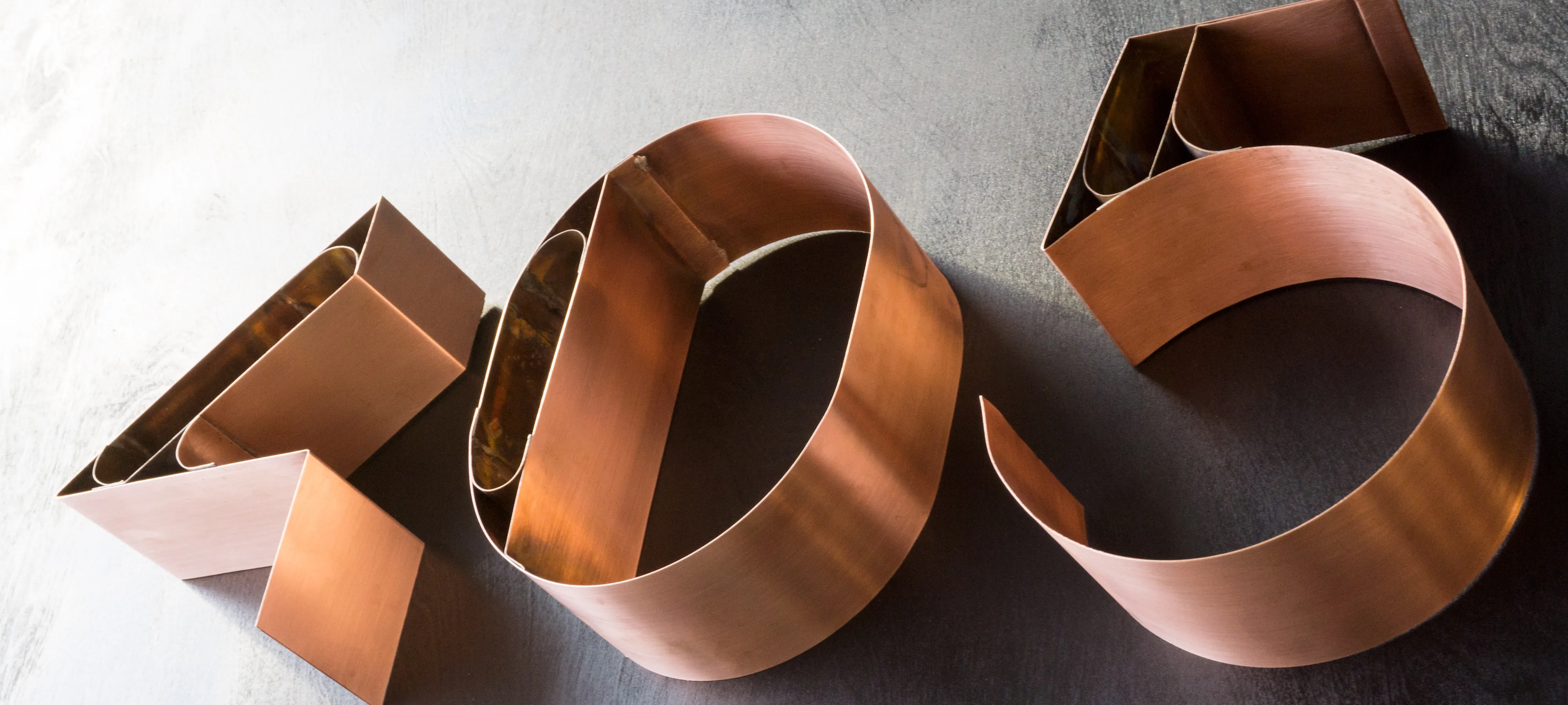 Copper numerals forming the number 405 seen from above.
