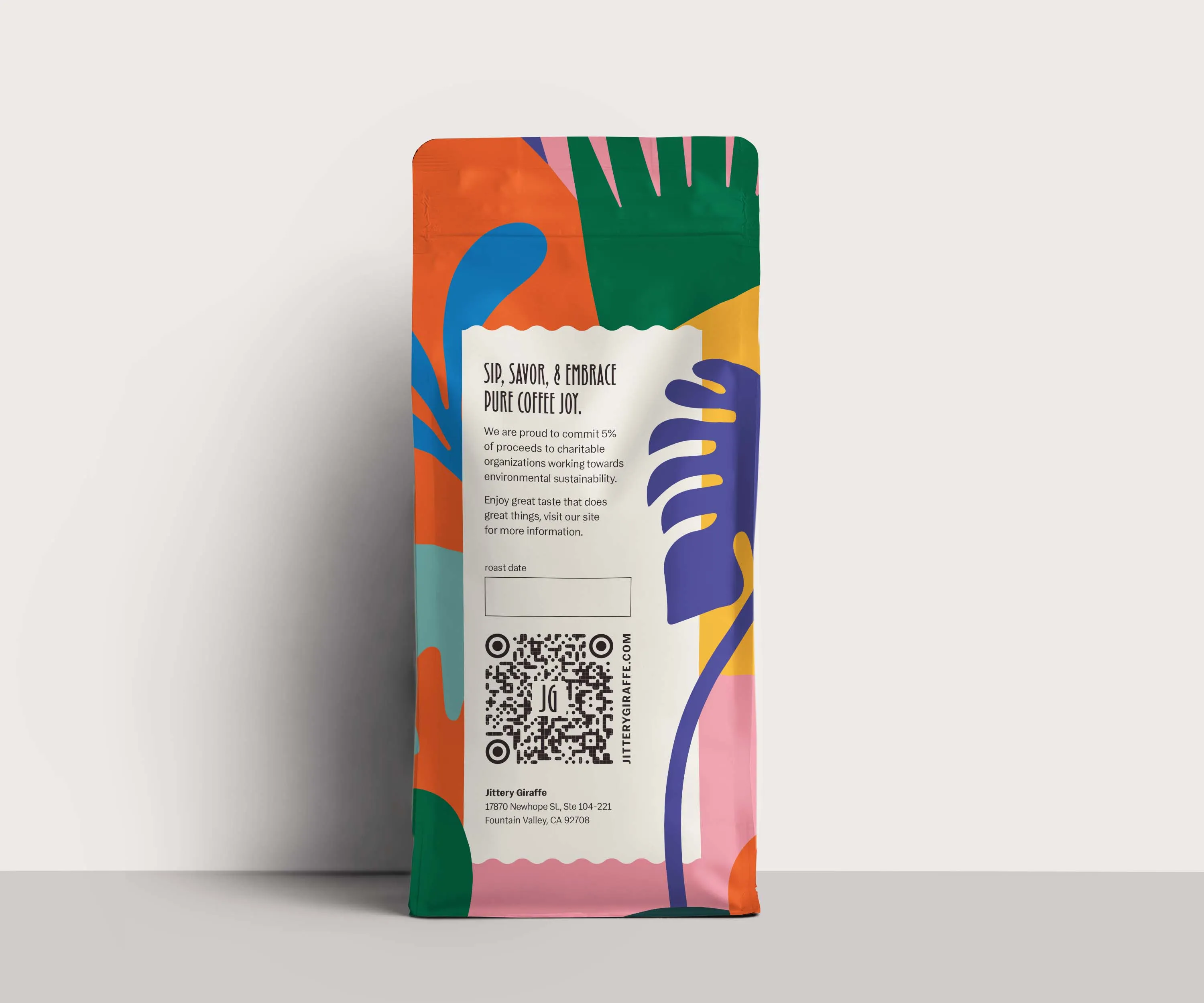 Jittery Giraffe bag leaning against a pale wall.