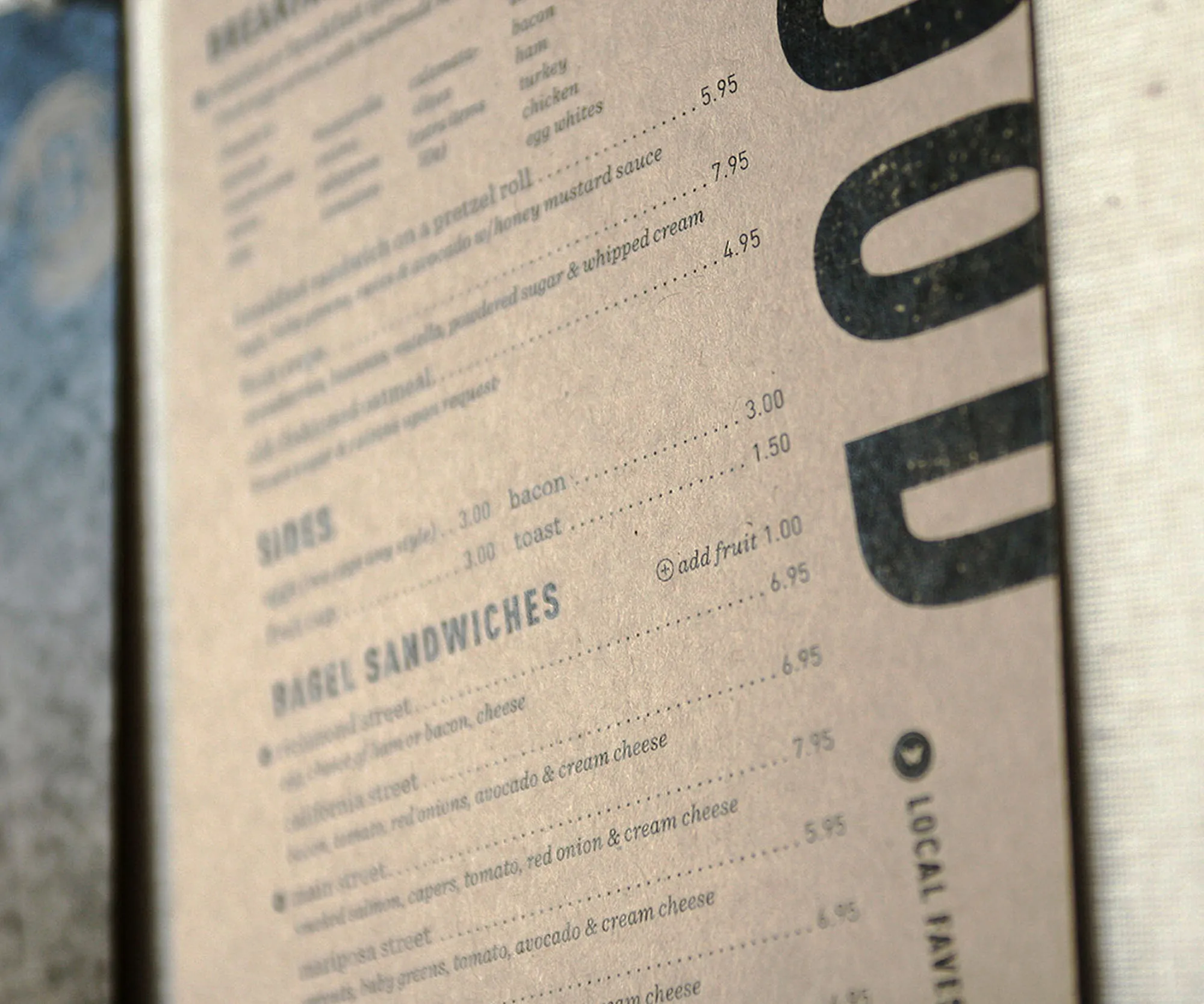 Close-up of the food menu typography on kraft paper.