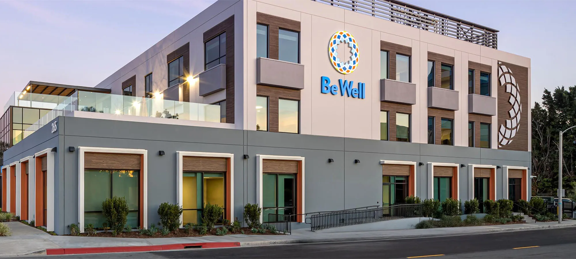 BeWell Orange County campus exterior at dusk.